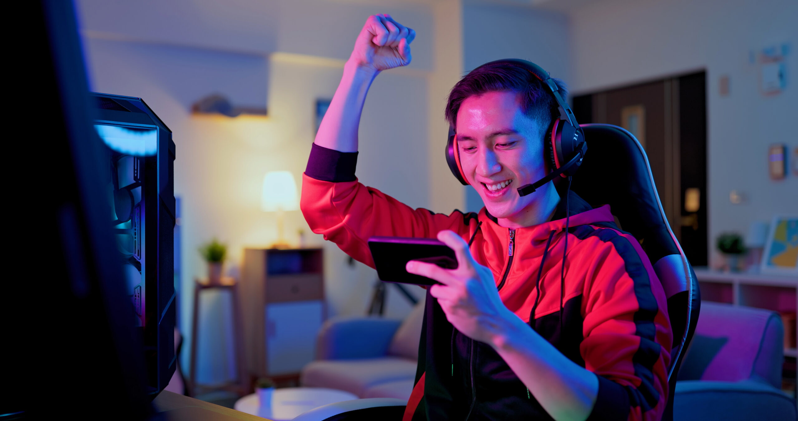 A person celebrating their score on a mobile-friendly video game.